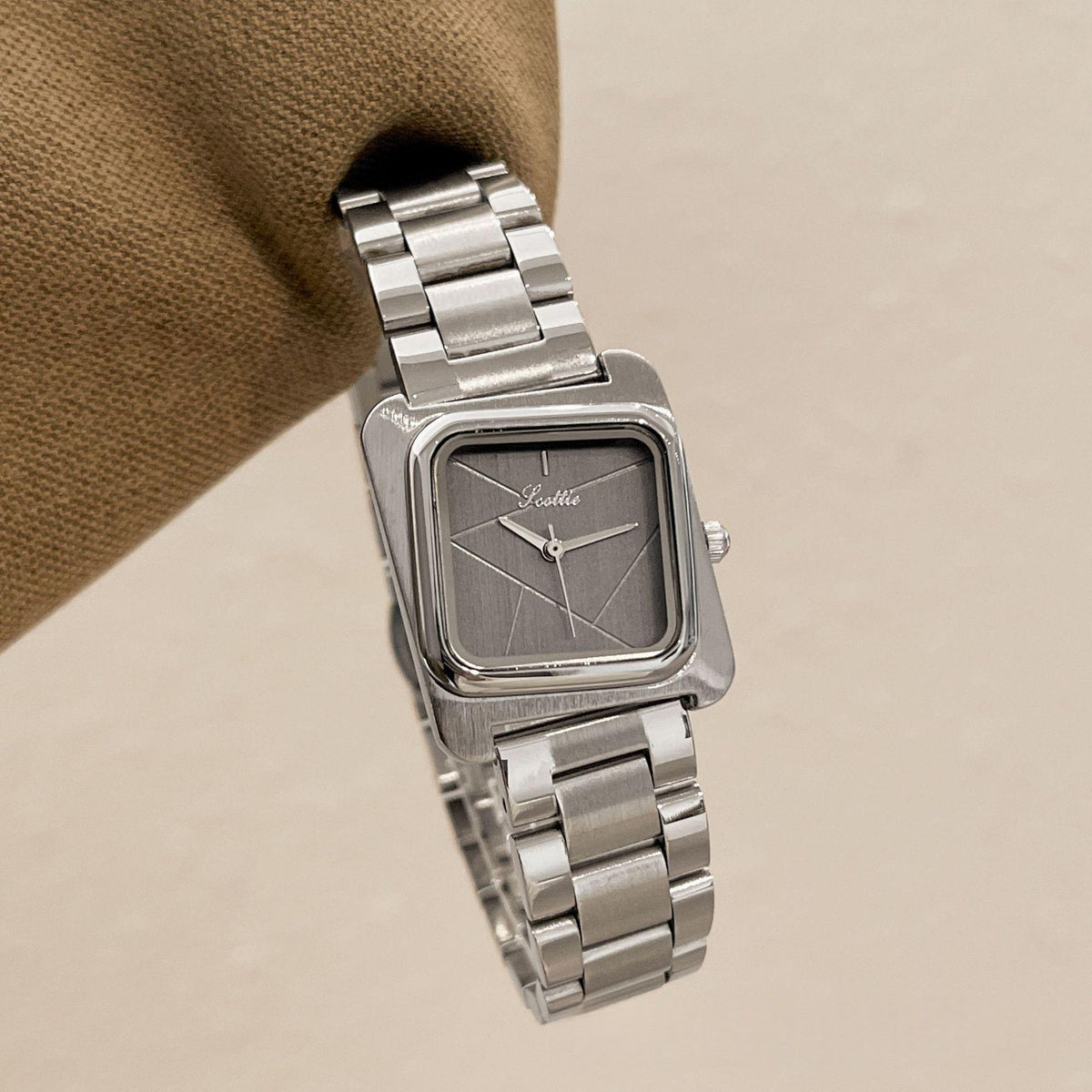 Square quartz watch with silver steel band and dark gray dial