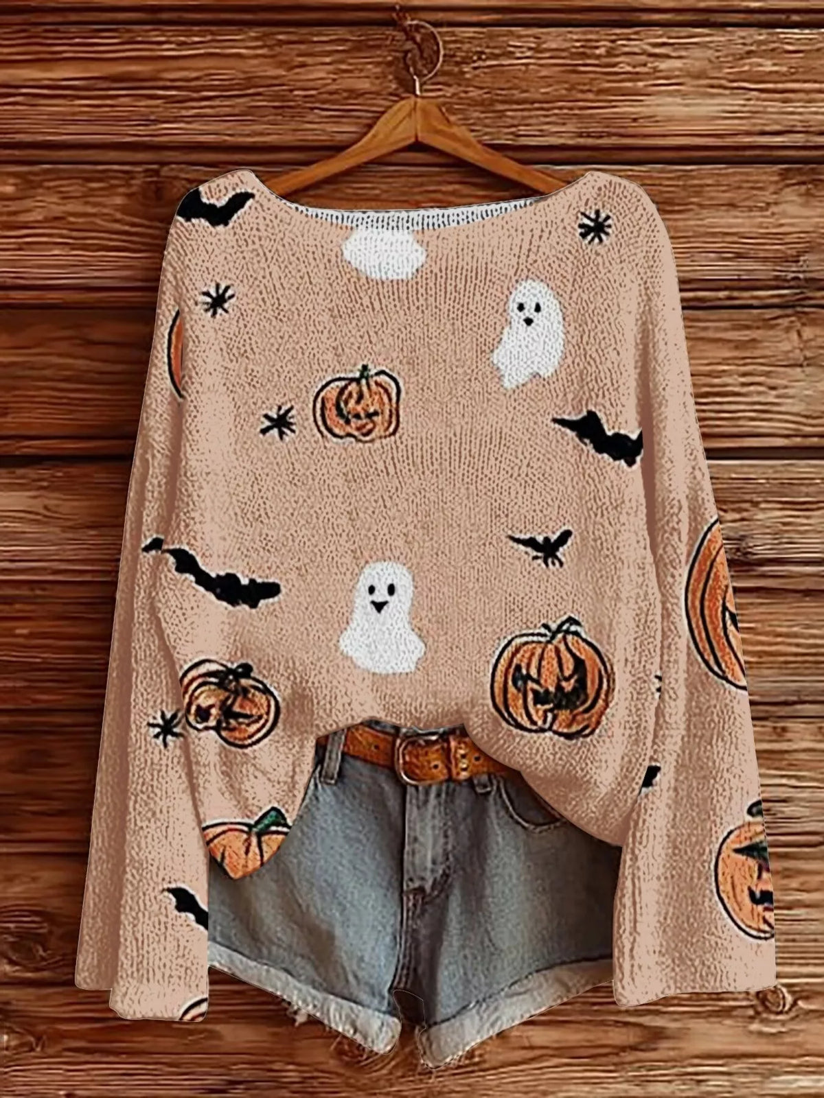 Pale blush Halloween boat-neck sweater with ghost, pumpkin, and bat graphic prints