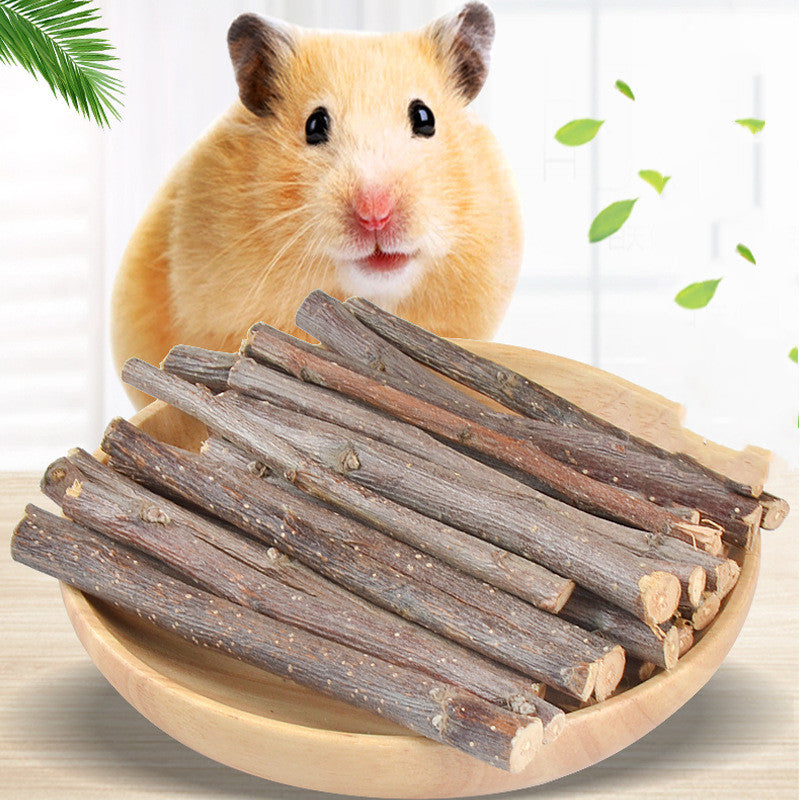 Dried branch pet treats in a wooden bowl, dark brown sticks with pale cut ends