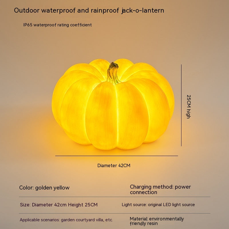 Golden yellow large pumpkin-shaped outdoor LED light with hanging loop, size shown
