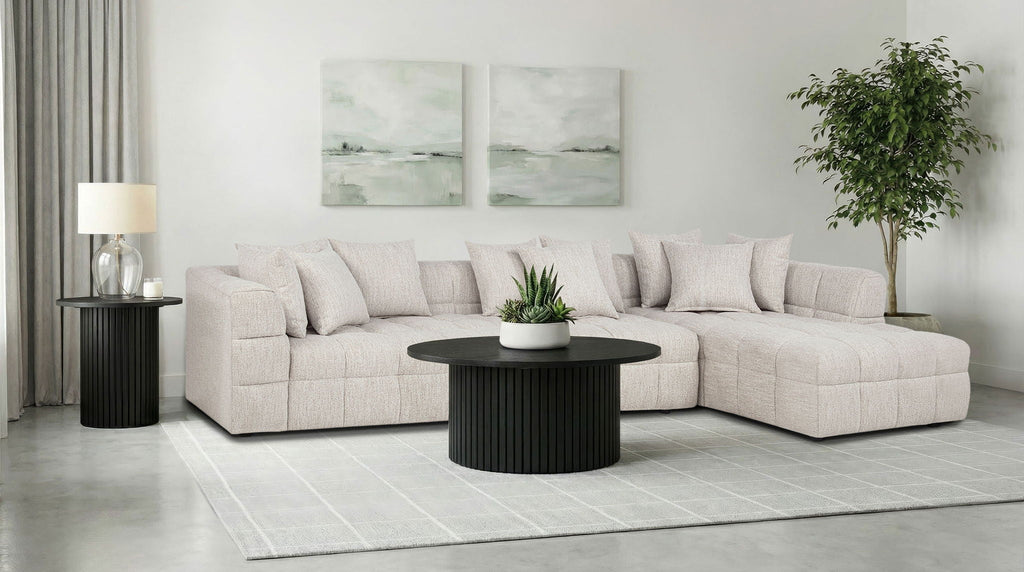 Light beige 3-piece sectional sofa with square arms and tufted seat cushions