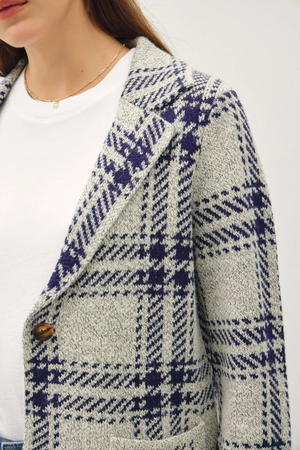 Navy plaid long-sleeve sweater jacket close-up of front patch pocket