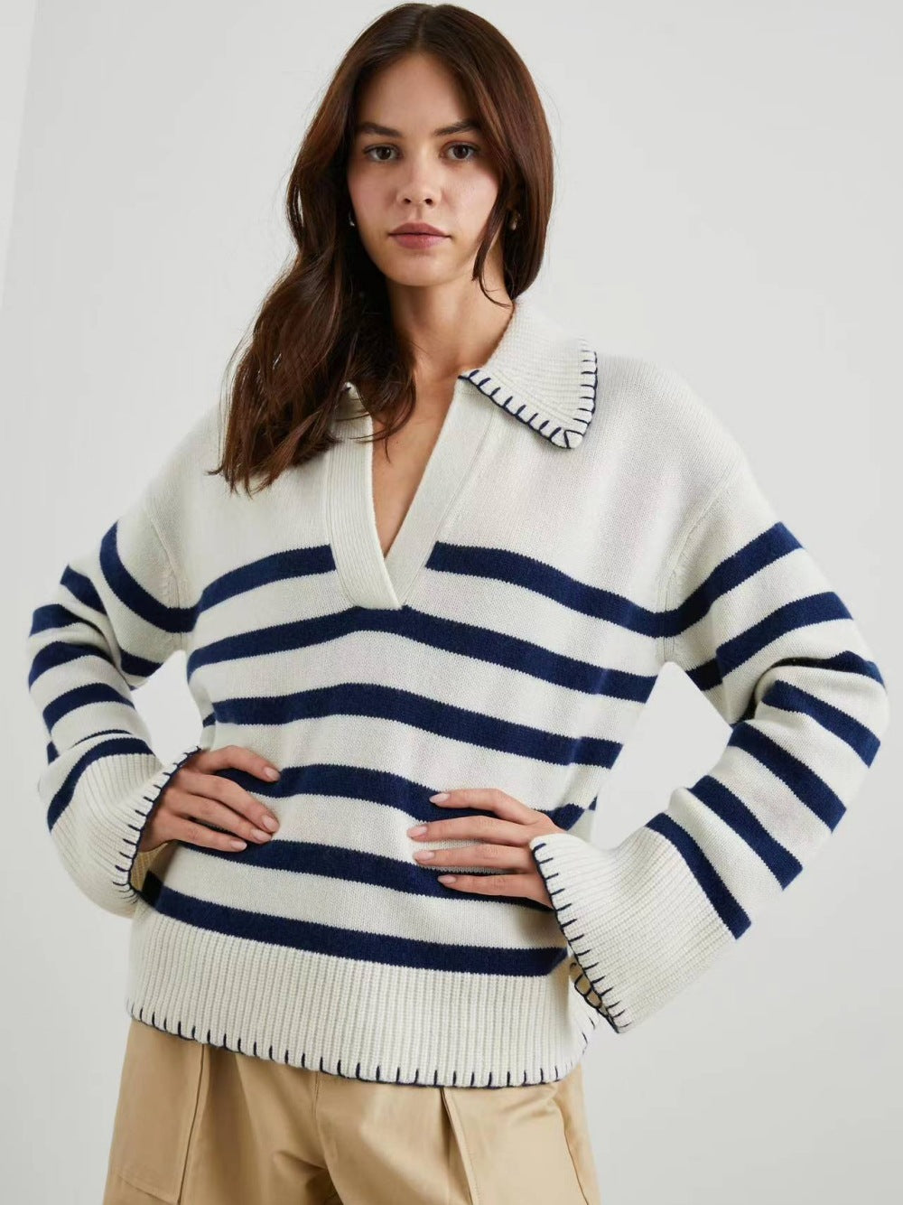 Women’s knit polo sweater in cream with navy-and-white horizontal stripes, long sleeves