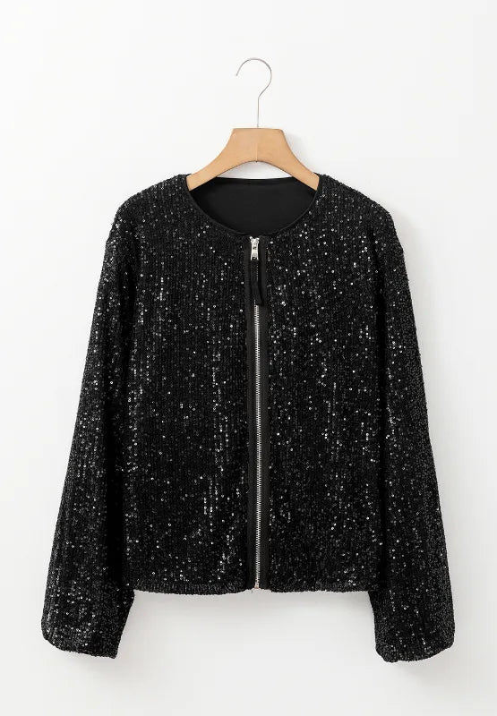 Black sequin zip-up long sleeve jacket with front zipper, hanging on a hanger