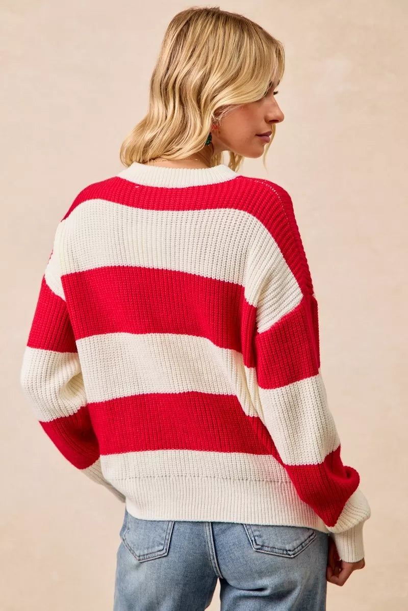 Red-and-ivory striped crewneck sweater with wide sleeve cuffs