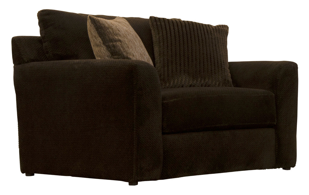 Midwood chair with dark fabric seat and block arms, styled with three throw pillows