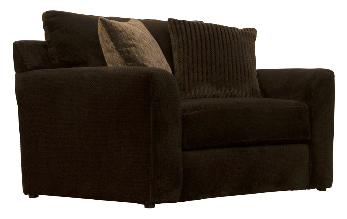Midwood chair with dark fabric seat and block arms, styled with three throw pillows