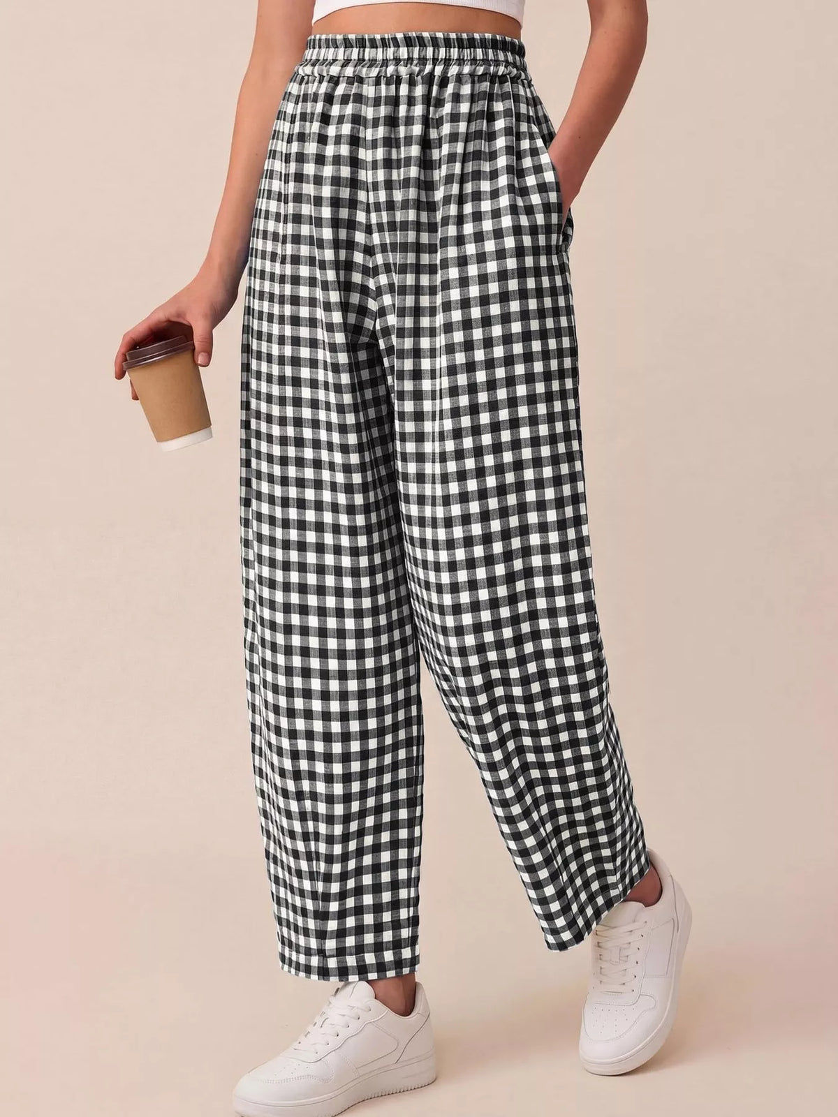 Black gingham wide-leg pants with elastic waistband and relaxed draped legs