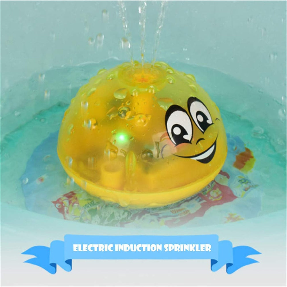 Transparent yellow UFO water sprinkler toy in pool, cartoon face with water spray
