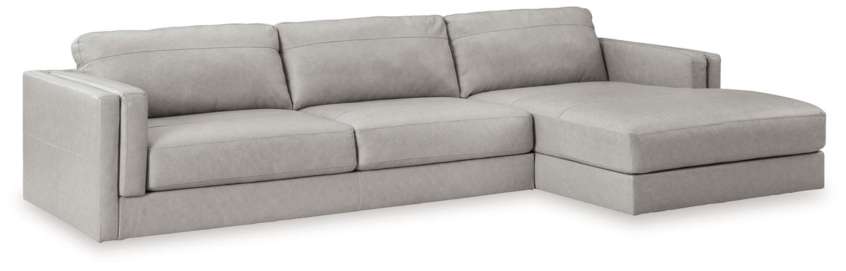 Light gray upholstered sectional sofa with corner chaise section and square cushions