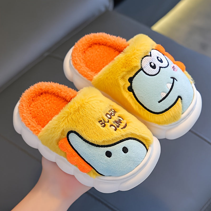 Girls' dinosaur slippers, close-up pair with yellow and orange plush uppers and dino faces