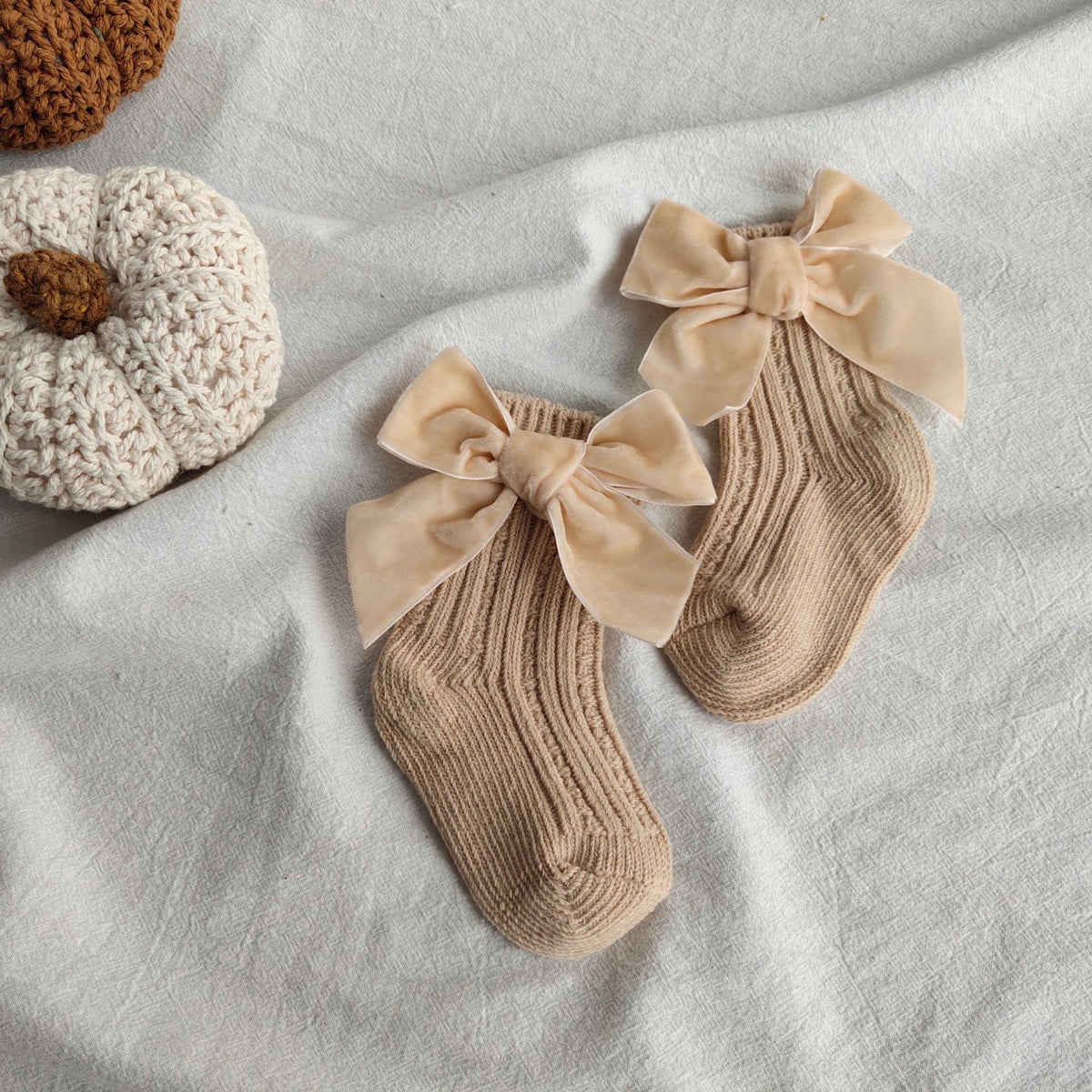 Beige wool tube socks with bowknot cuffs