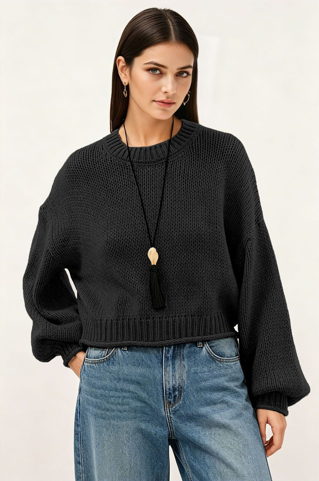 Women’s loose-fit knit sweater, textured black, round neck, long sleeves, ribbed hem