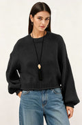 Women’s loose-fit knit sweater, textured black, round neck, long sleeves, ribbed hem