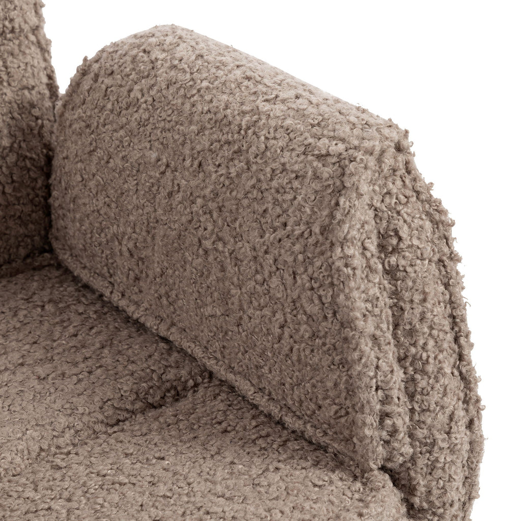 Close-up of brown upholstered armrest and seat texture on swivel desk chair