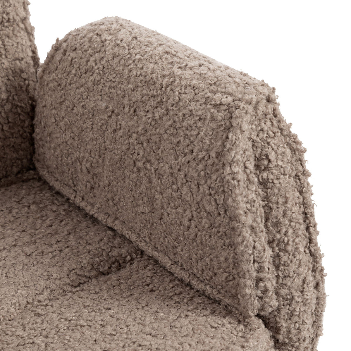 Close-up of brown upholstered armrest and seat texture on swivel desk chair