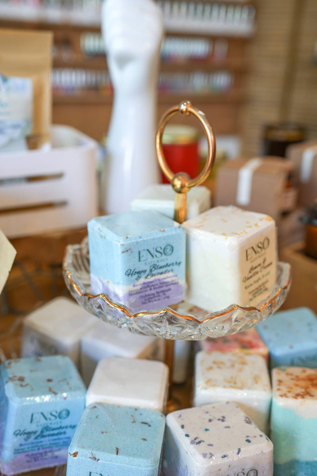 Jumbo square bath bombs, blue-to-cream gradient, stacked with botanical speckles