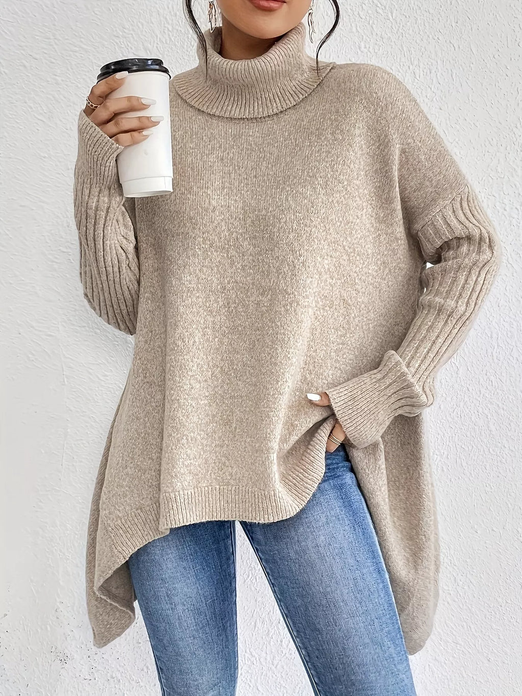 Grey turtleneck high-low hem sweater with ribbed cuffs and loose drape fit
