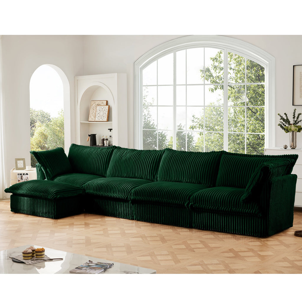 Green L-shaped sectional sofa with left-side chaise, ribbed slipcover, tufted-style seat cushions.