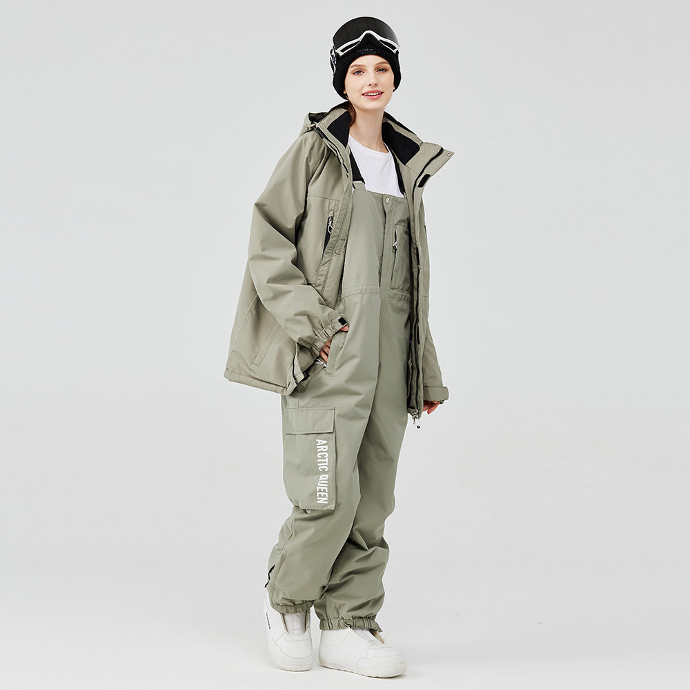Olive green winter ski suit with hooded jacket and snow pants, black beanie and boots