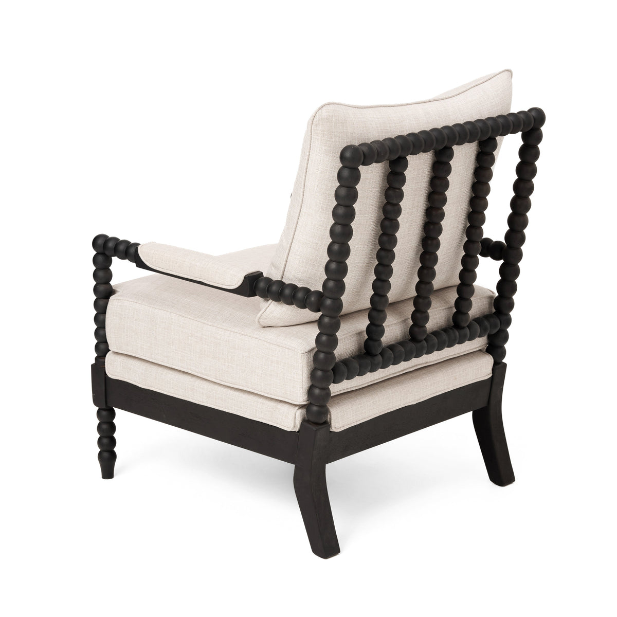 Rear three-quarter view of an accent chair with black beaded frame and cream upholstery