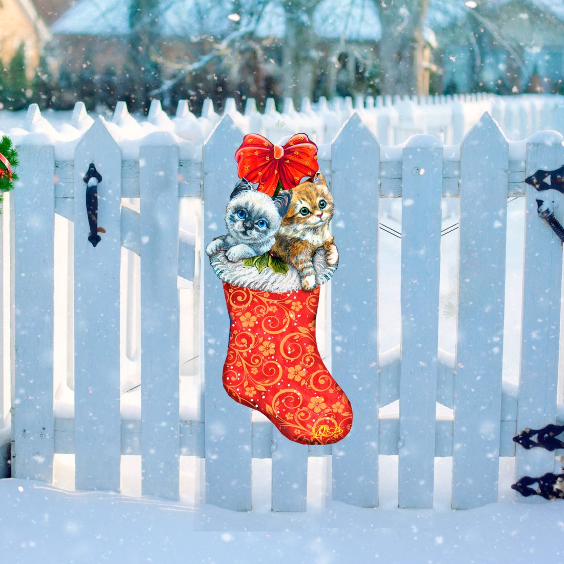 Red Christmas stocking door decor featuring two kittens peeking from the top