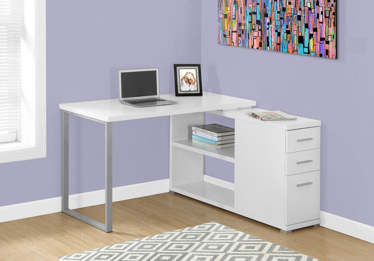 L-shaped computer desk in white with open storage cubby and three-drawer tower