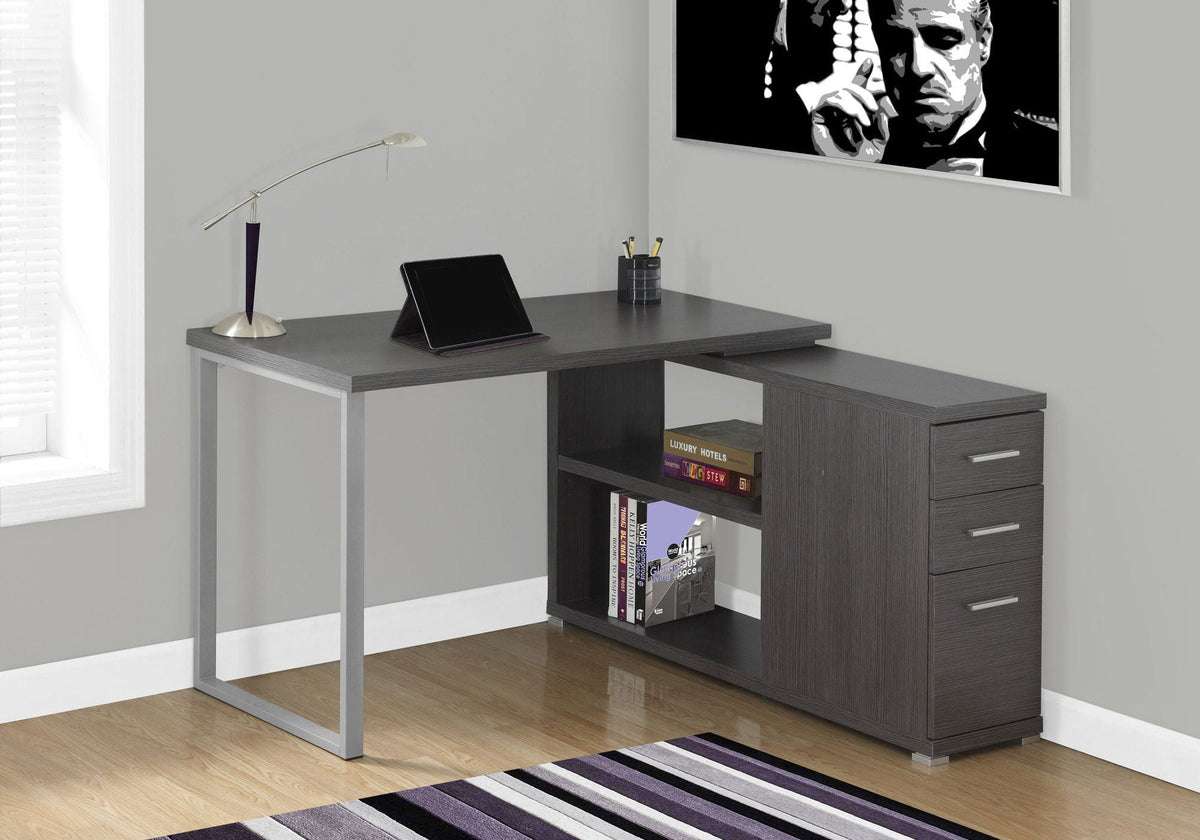 Dark gray L-shape computer desk with right-side drawers and open book shelf