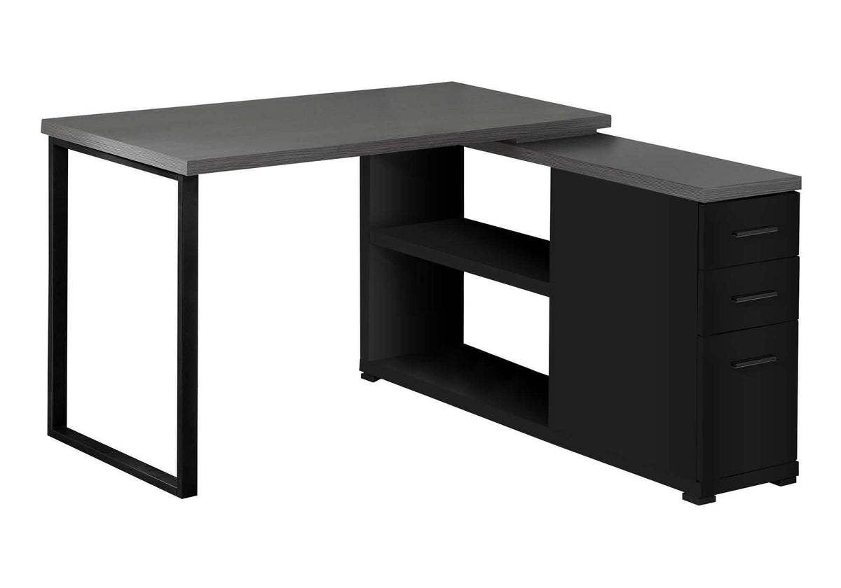 Black L-shaped computer desk with open shelving and three-drawer storage tower