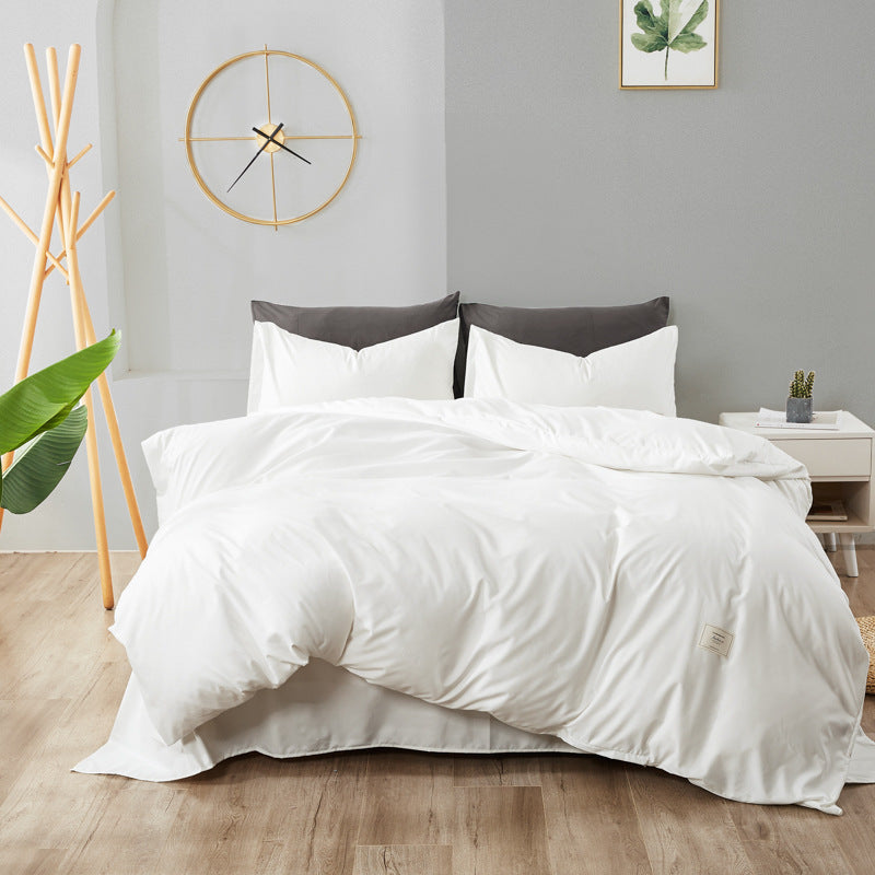 White bedding set with dark gray accent pillowcases and duvet cover