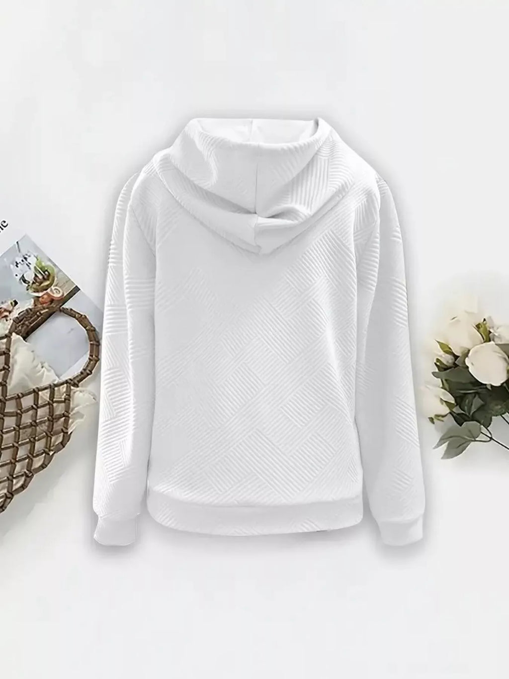 White textured zip-up hooded jacket with diagonal pattern and drawstring hood