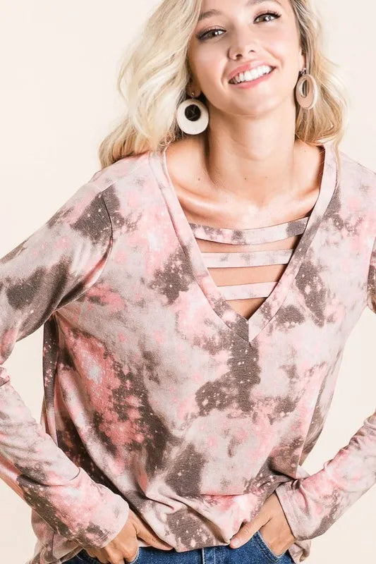 Tie-dye V-neck top with crisscross neckline straps and long sleeves, mottled print