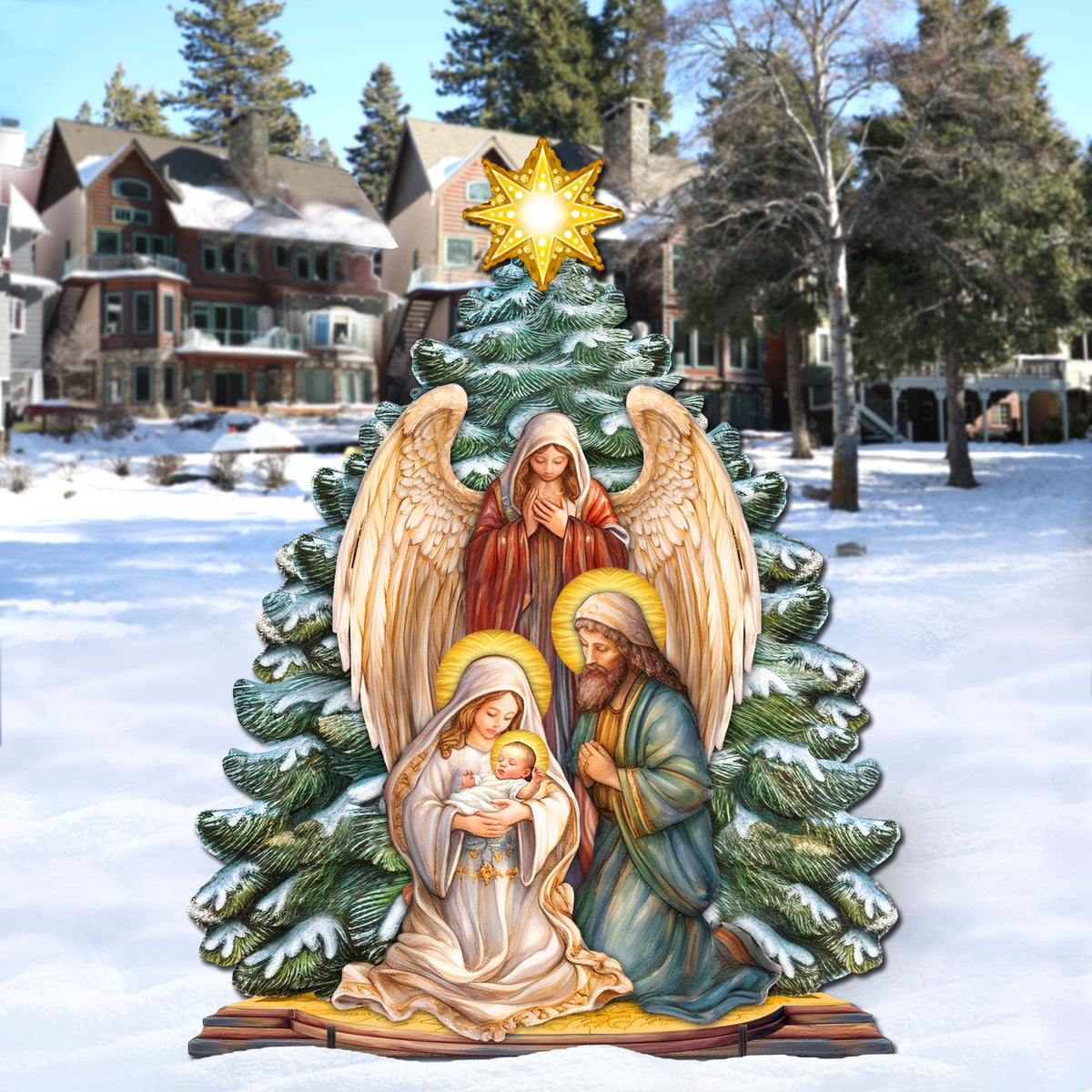 Outdoor nativity decor with glowing star, angel wings, Mary holding baby Jesus, and Joseph