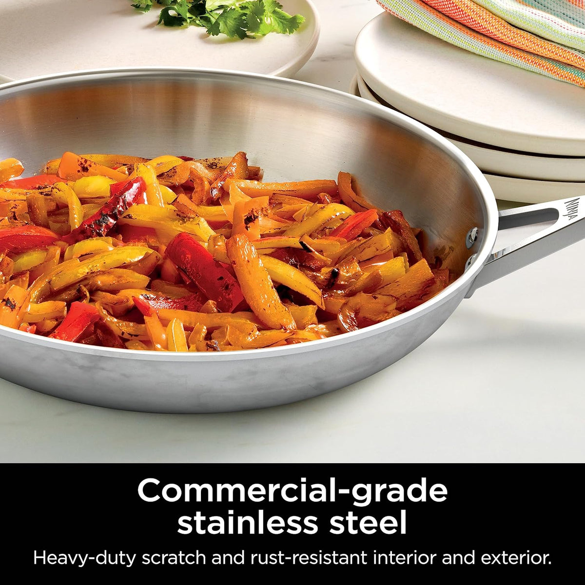 Stainless steel skillet with cooked vegetables