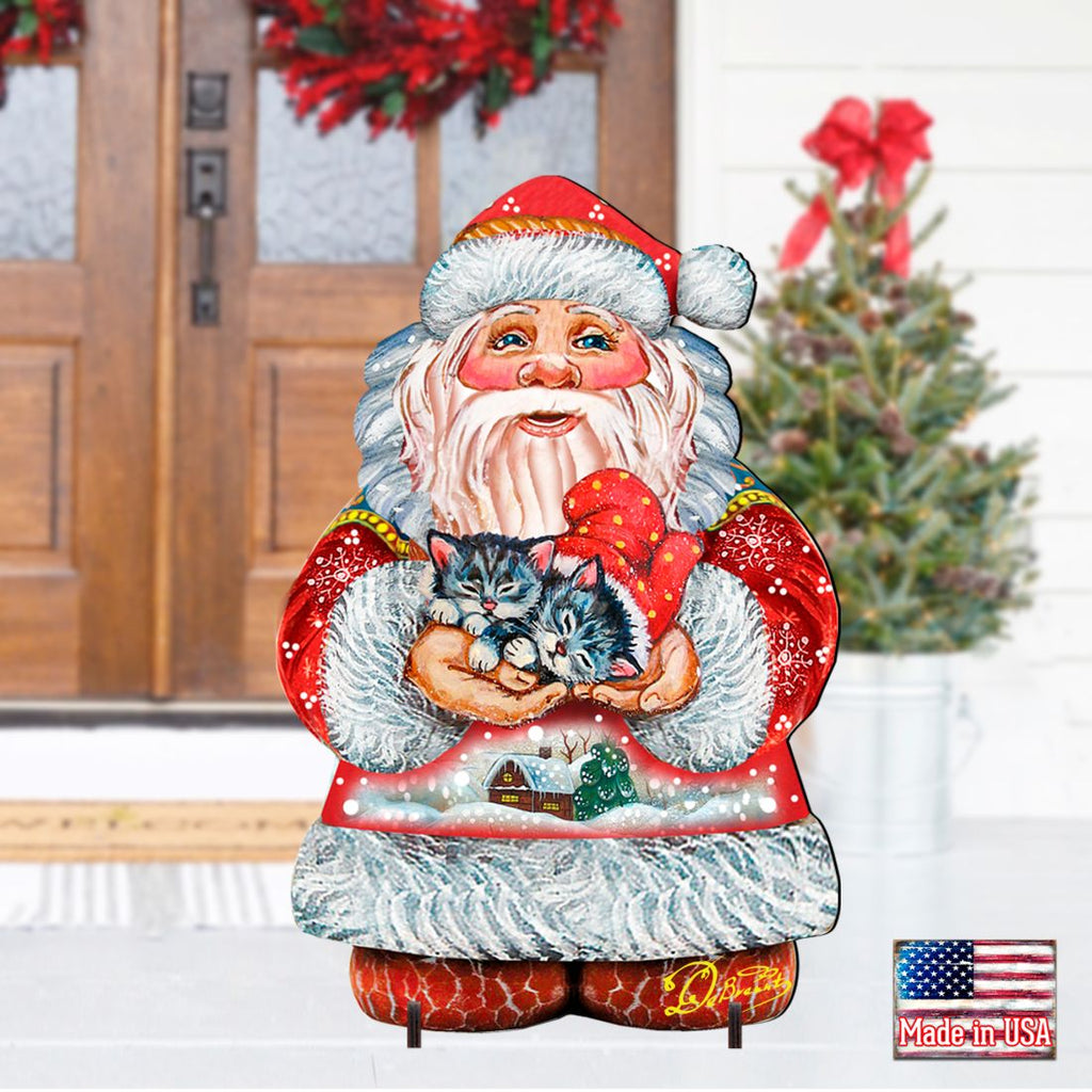 Santa holding a kitten yard sign with red hat and white beard, freestanding cutout