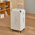 Large capacity trolley suitcase in white with ribbed shell, telescoping handle, 4 wheels