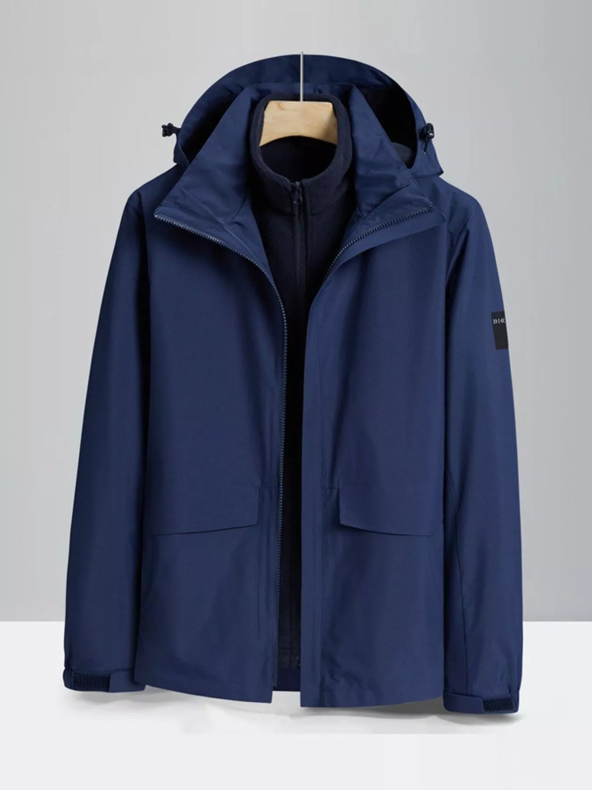 Dark blue zip-up hooded waterproof jacket with front pockets