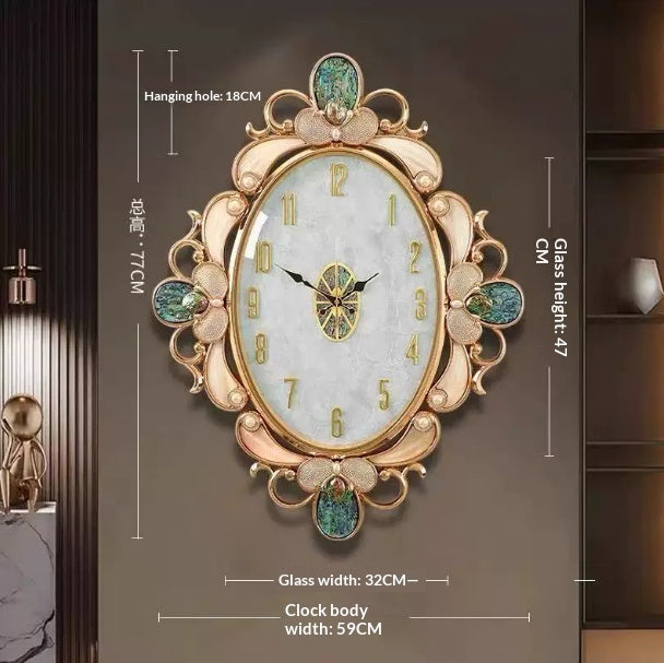 Shell-shaped wall clock with oval glass face, gold ornate frame and green floral accents