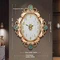 Shell-shaped wall clock with oval glass face, gold ornate frame and green floral accents