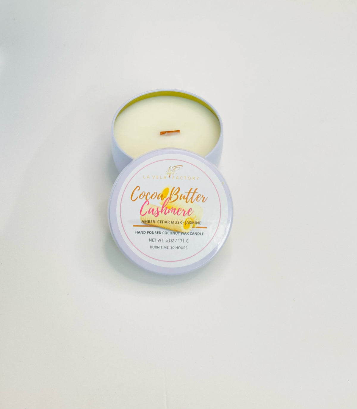 Wood wick candle with Cocoa Butter Cashmere label in round tin