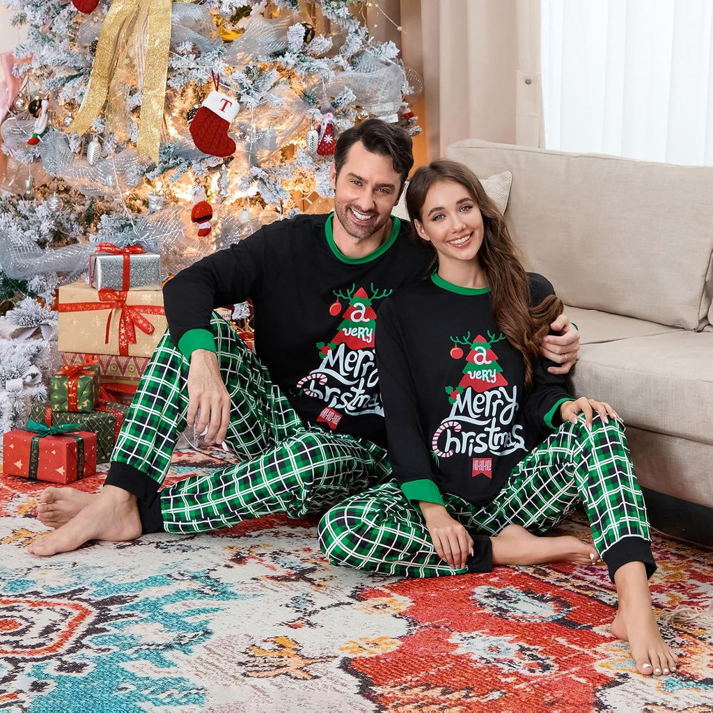 Christmas family pajama set: black tops with festive print and green plaid pants