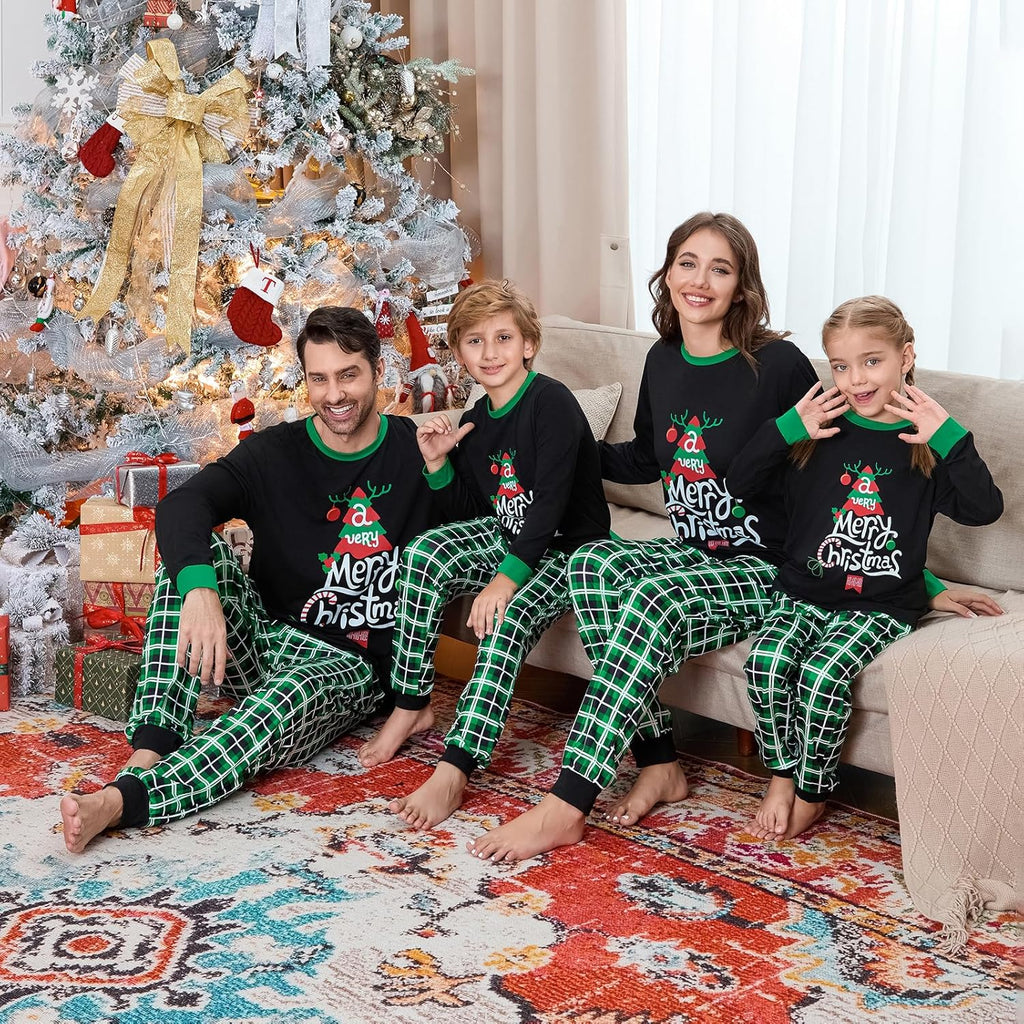 Family Christmas pajama outfits with black tops, green-trim cuffs, and green plaid pants