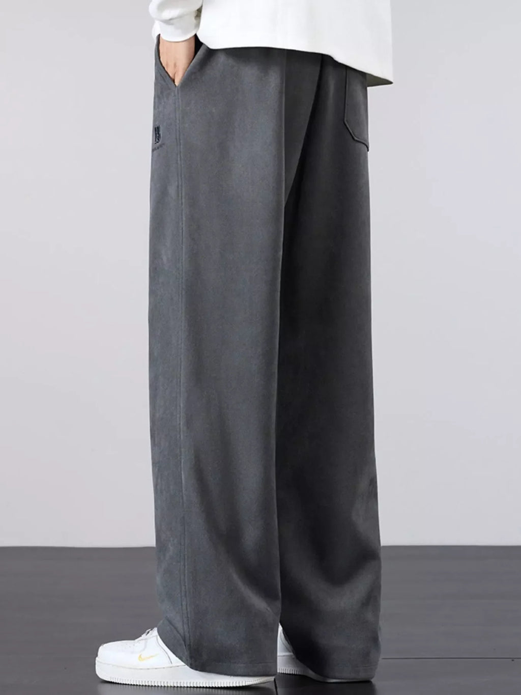Men's gray drawstring wide-leg pants with elastic waist and side pocket