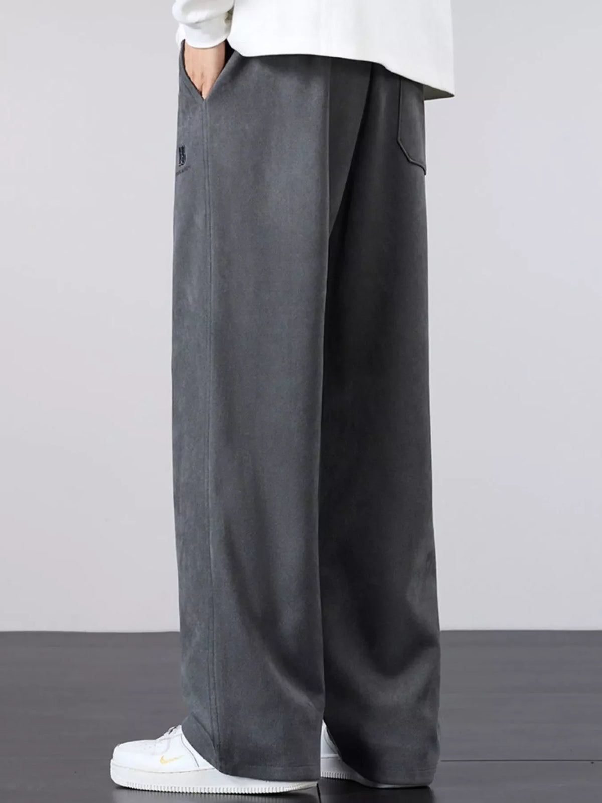Men's gray drawstring wide-leg pants with elastic waist and side pocket