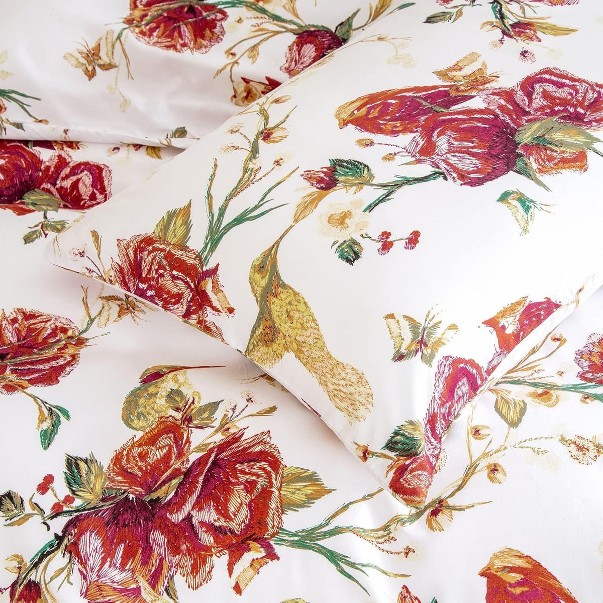 White pillowcase with close-up burgundy rose, bird and floral pattern in watercolor style.