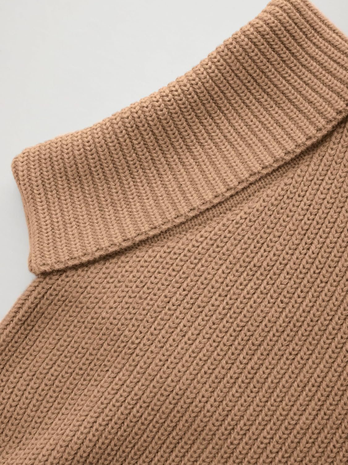 Tan ribbed knit turtleneck sweater close-up, chunky collar texture