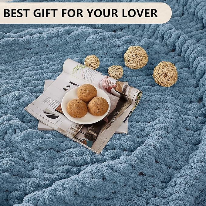 Airy blue chunky chenille knit throw blanket laid flat with textured surface