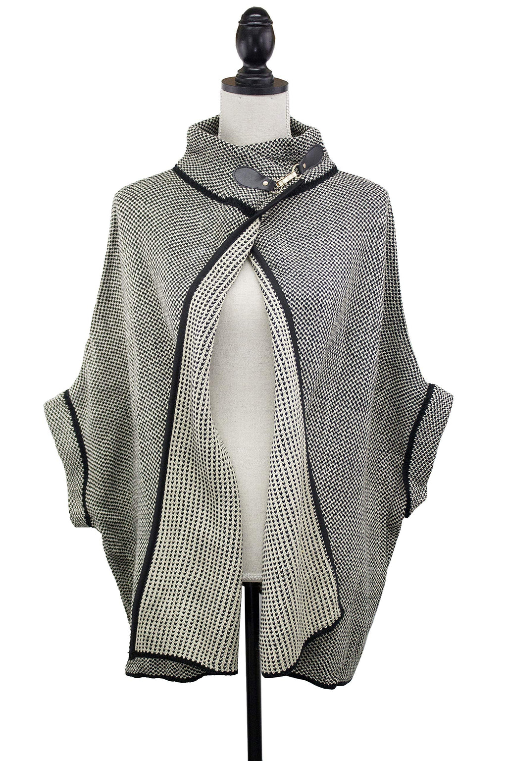 Grey knit poncho cardigan with black contrast trim, neck buckle, open front