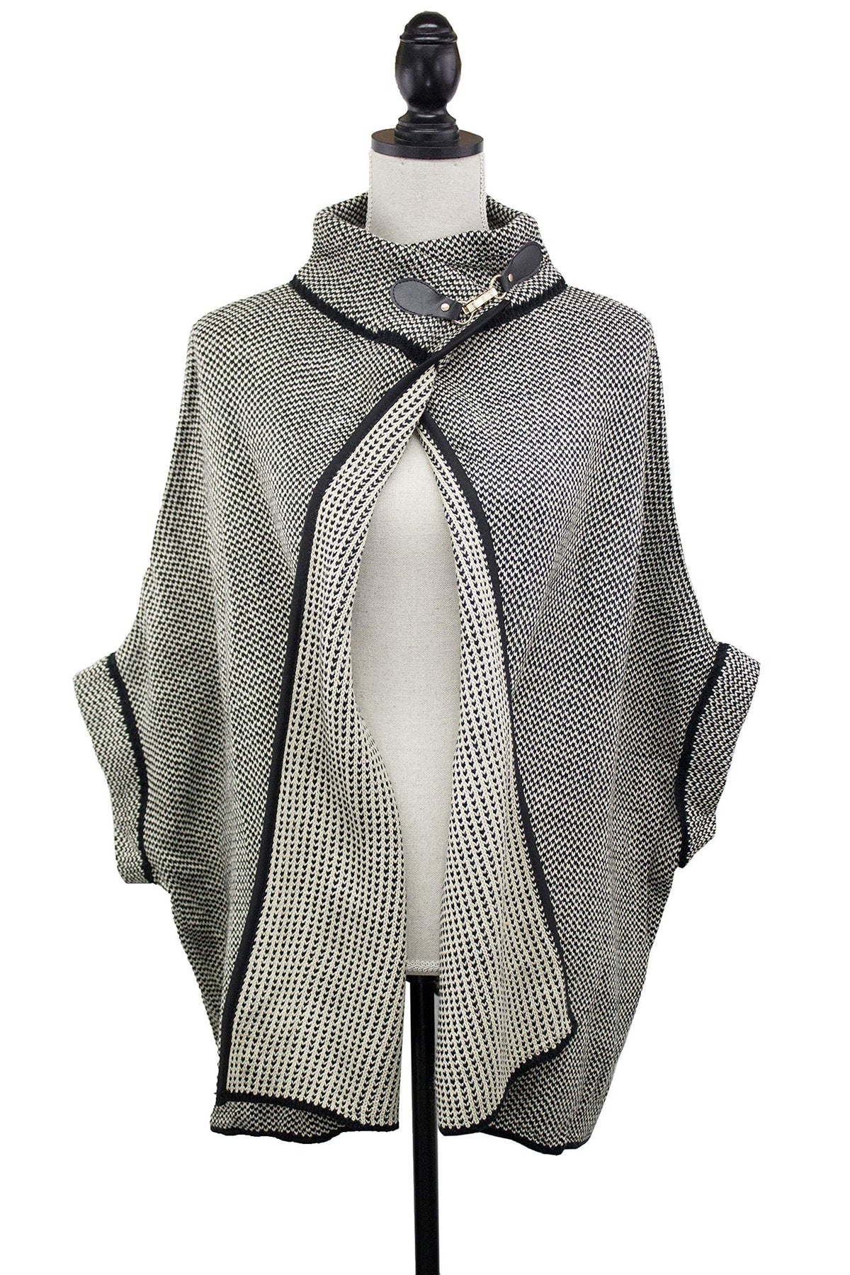 Grey knit poncho cardigan with black contrast trim, neck buckle, open front