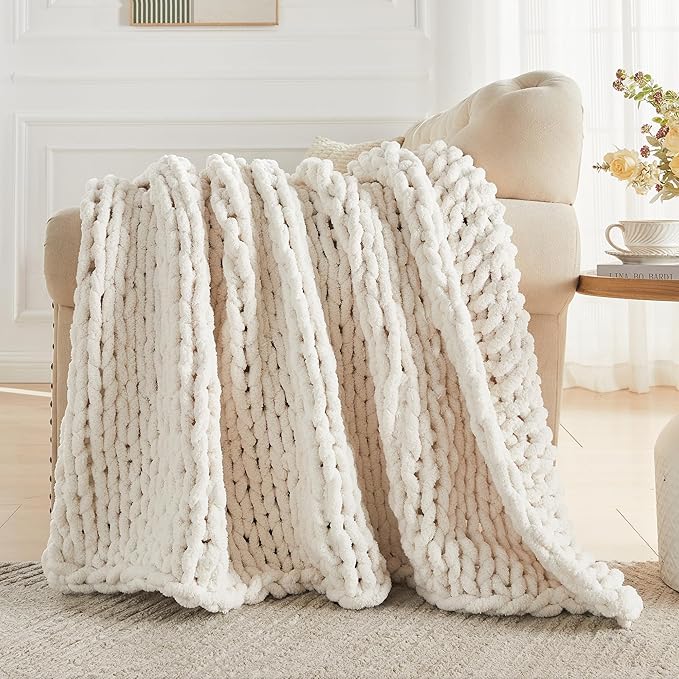 Cream chunky knit throw blanket with vertical ribbed cable stripes and fluffy loop yarn